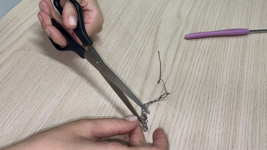 Cutting thread in half